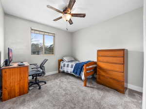 Bedroom with carpet and ceiling fan