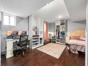 Bedroom with dark wood-style floors