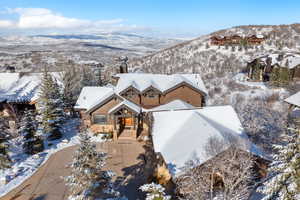 Snowy aerial view with a mountain view