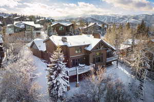 Snowy aerial view with a mountain view