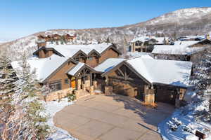 Snowy aerial view featuring a mountain view