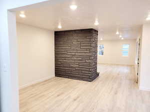 Unfurnished room with light wood-type flooring