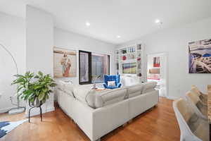 Living room with light hardwood / wood-style flooring