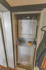 Laundry room featuring stacked washer / dryer