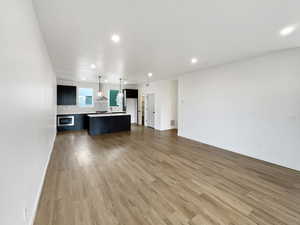 Unfurnished living room with wood-type flooring