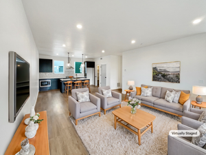 Living room with light hardwood / wood-style flooring