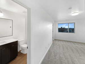 Bathroom featuring vanity and toilet