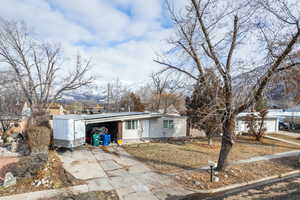 View of front of home featuring a carport