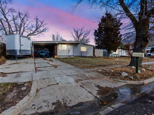 View of front of property featuring a carport