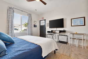 Bedroom featuring tile patterned floors and ceiling fan