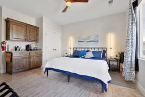 Bedroom with a closet and ceiling fan