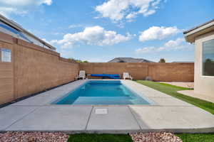 View of pool with a patio area