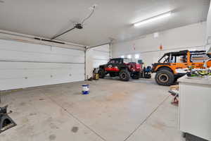 Garage featuring a garage door opener