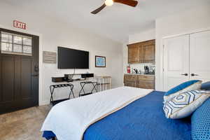 Bedroom with a closet and ceiling fan