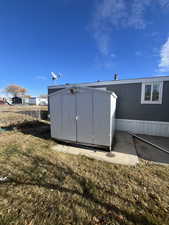 Exterior space featuring a yard