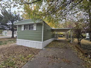 View of side of home featuring a carport