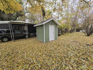 View of outdoor structure with a carport