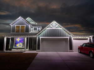 Craftsman-style home with a porch and a garage