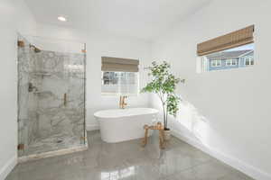 Bathroom featuring separate shower and tub