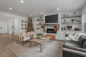 Living room featuring a fireplace and hardwood / wood-style floors