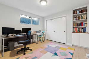 Office area featuring light hardwood / wood-style floors