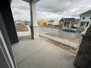 Patio off from kitchen, garage, and stairs to basement.