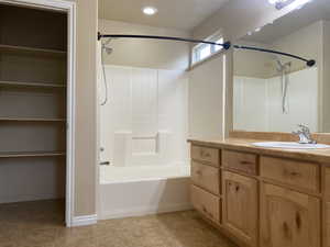 Bathroom featuring vanity and bathtub / shower combination