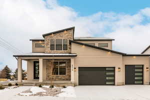 Contemporary house featuring covered porch