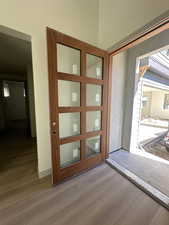 Entryway with wood finished floors