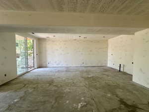 Basement family room featuring a wetbar and walk out entrance