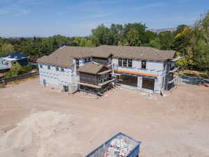 Back of house with driveway