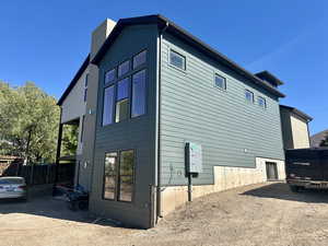 View of property exterior with a chimney