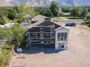 Back of house includes a deck off the main floor and walkout basement