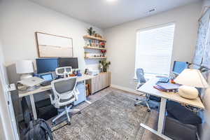 View of carpeted home office