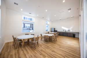 Dining room featuring light wood-type flooring and sink