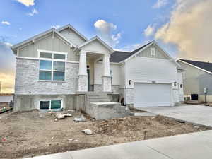 View of front of property featuring a garage