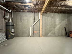 Basement with strapped water heater