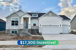 Craftsman house featuring a garage