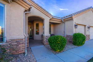 Property entrance featuring a garage