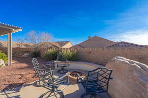 View of patio featuring a fire pit