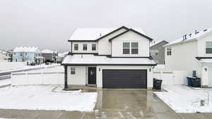 View of front of home with a garage