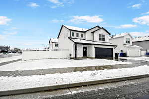 View of front of home featuring a garage