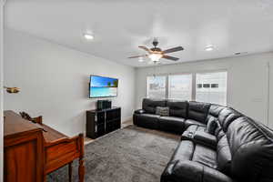 Living room featuring ceiling fan