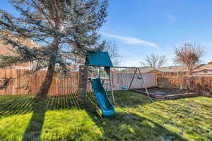 View of yard featuring an included swingset