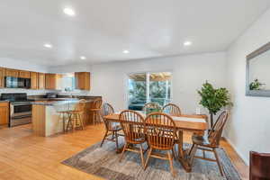 Dining room featuring sink and bamboo floors