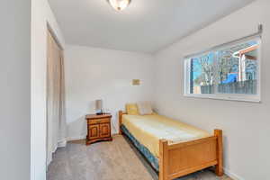 Bedroom with light colored carpet