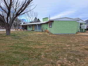 Exterior space with a front lawn