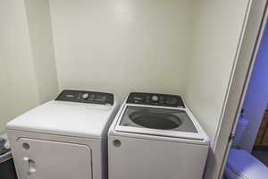 Washroom featuring separate washer and dryer