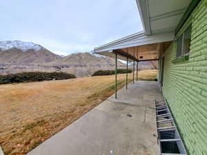 Exterior space featuring a mountain view and a patio