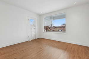 Unfurnished room with hardwood / wood-style flooring